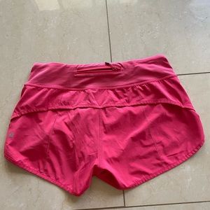 Like new, gently used Hot pink Lululemon speed up shorts.